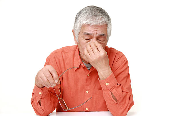 istock senior Japanese man suffers from headache 464798032