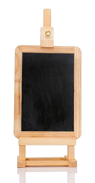 istock An isolated shot of a blank chalkboard on easel. 464798141