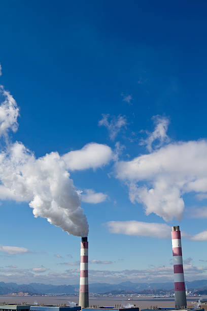 istock Smokestack and Gas Emissions  Against Blue Sky. 464801570