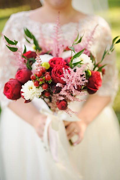 Bride holding a bouquet of beautiful roses
