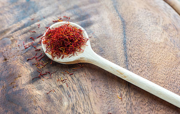 istock Saffron on the wooden spoon 464803206