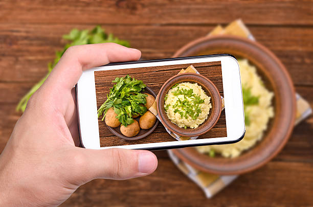 istock Hands taking photo mashed potato with smartphone. 464806756