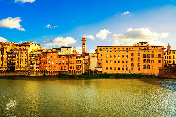 Arno river and buildings architecture landmark on sunset. Floren