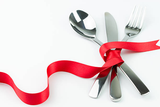 istock Set of silverware tied up with a red ribbon 464808415