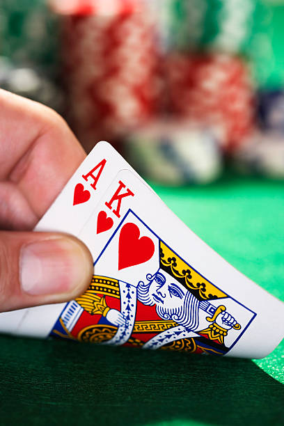 istock Hand Peeked At Two Cards 464810653