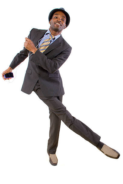 istock Young Black Businessman Dancing to Streaming Music 464811185
