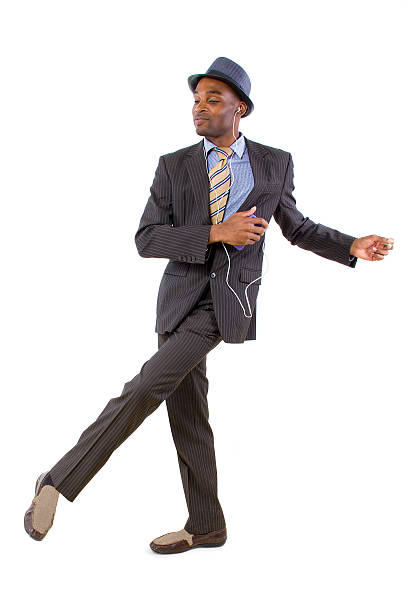 istock Young Black Businessman Dancing to Streaming Music 464811187