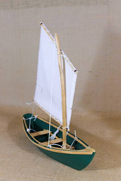 istock Model Dory Sailboat Against Burlap Background 464811528