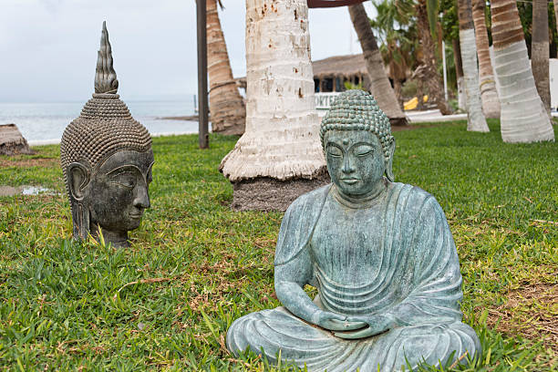 istock buddha copper statue near the sea 464811724