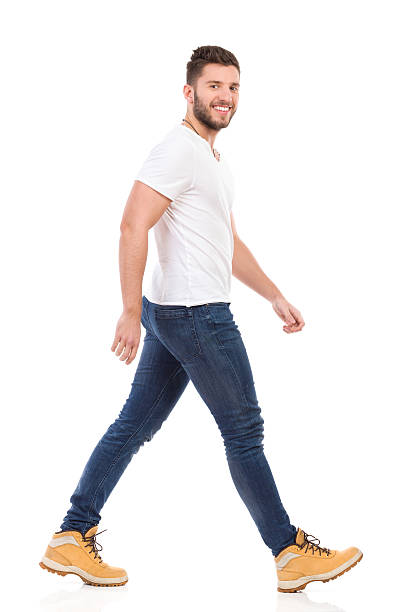 istock Young man marching in jeans and white t-shirt 464811796