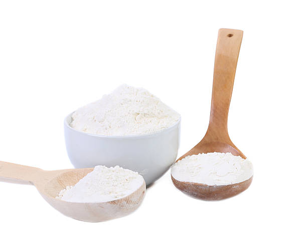 istock Spoon and bowl with flour. 464816130