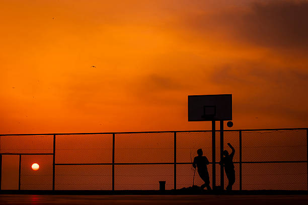 istock Teenagers playing basketball 464816162