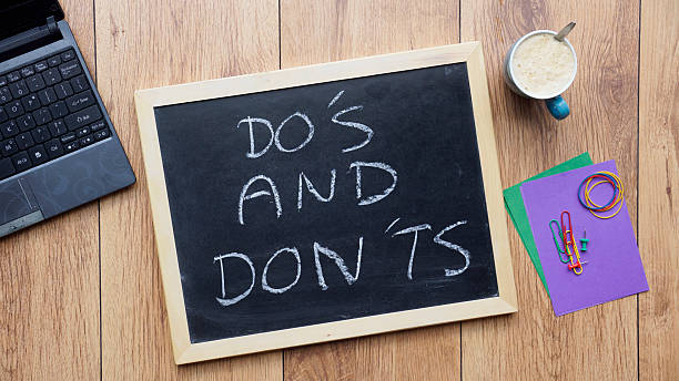 Do's and don'ts written stock photo
