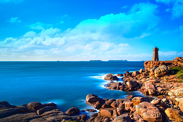 istock Ploumanach lighthouse sunset in pink granite coast, Brittany, Fr 464822956