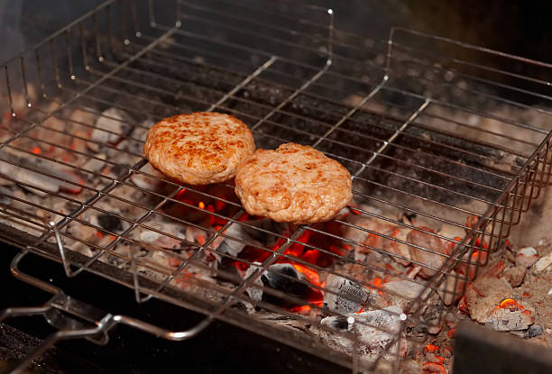 istock Cutlets being fried on charcoal grill 464823435