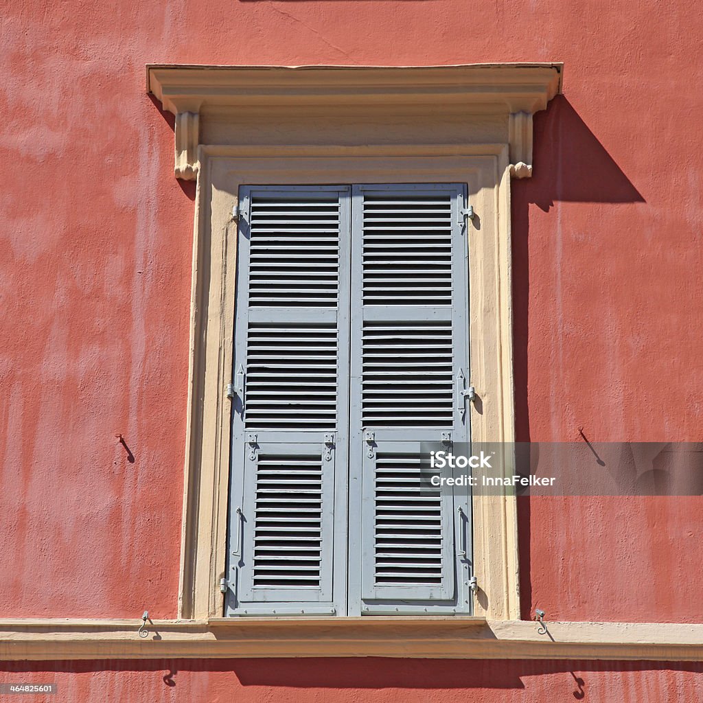 shutter window , Nice, French Riviera, France. typical old grey french shutter window in red house of Nice, Cote d'azur, France. Square shape image Abstract Stock Photo