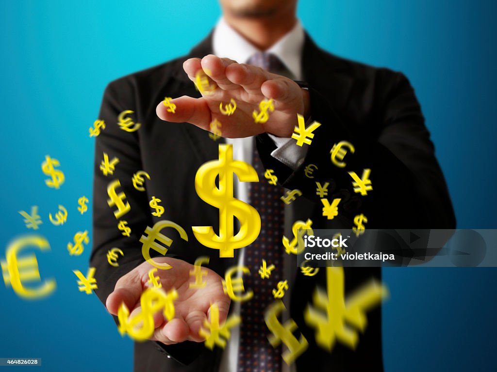 businessman with financial symbols businessman with financial symbols coming from hand 2015 Stock Photo