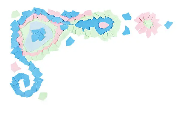 Decorative border element of pastel colored paper scraps.