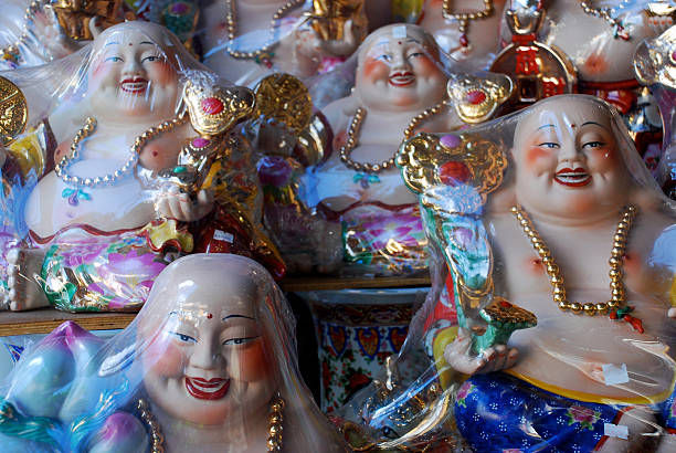 istock Laughing Buddha figurines in shop 464829480