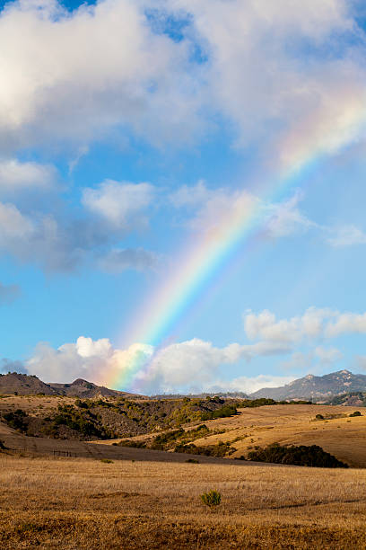 Rainbow over ranch landscape stock photo