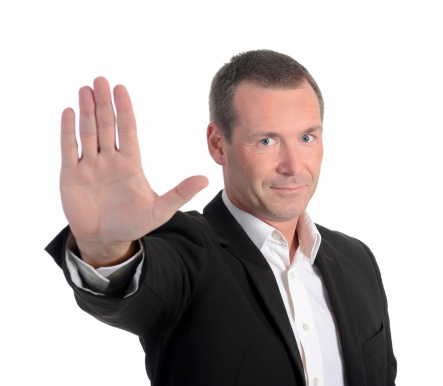 businessman showing stop with one hand