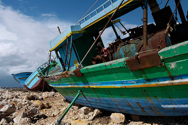 Refugees boat cemetery stock photo