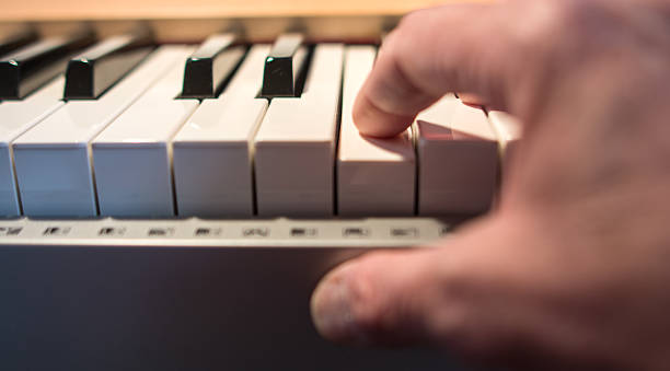 istock Senior pianist playing a piano- hands only. 464831342