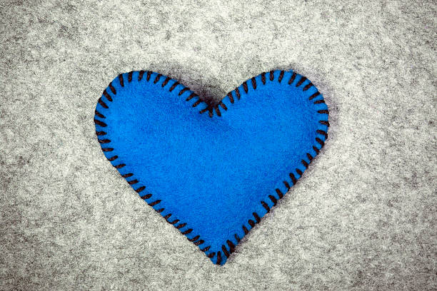 istock blue felt heart on a gray background 464831956
