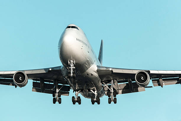 istock Jumbo jet airplane landing 464831978