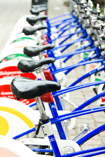 istock Public Bicycles parked on a street in line 464832059