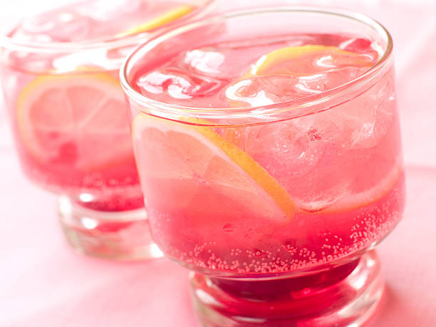 Two ice cold glasses of pink lemonade stock photo