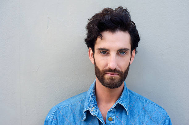 istock Close up portrait of a young man with beard 464832158