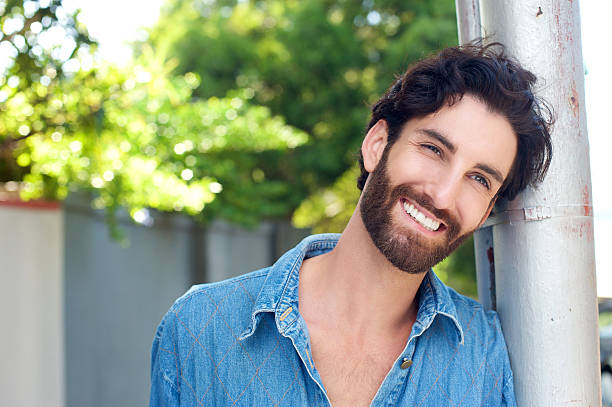 istock Close up happy man with beard smiling outdoors 464832160
