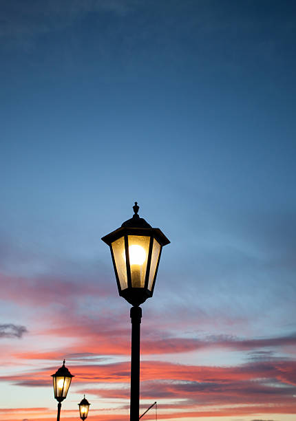 istock old lamps shining in sunset sky 464832573