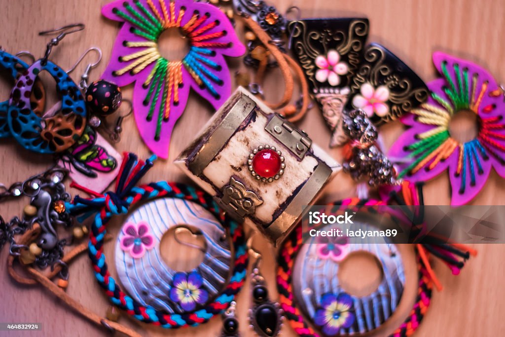 Handmade jewels Handmade jewels, earrings, bracelets, and a beautiful coffer which is decorated with a red stone. 2015 Stock Photo