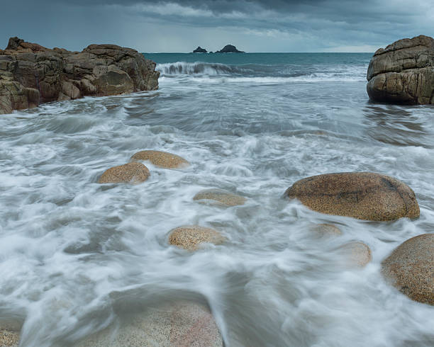 Rushing Tide at Porth Nanven Beach, North Cornwall stock photo