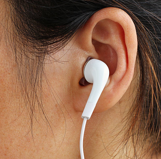 istock Earphone in a Girl's Ear 464835738