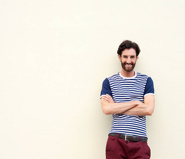 istock Happy smiling man posing with arms crossed 464836100