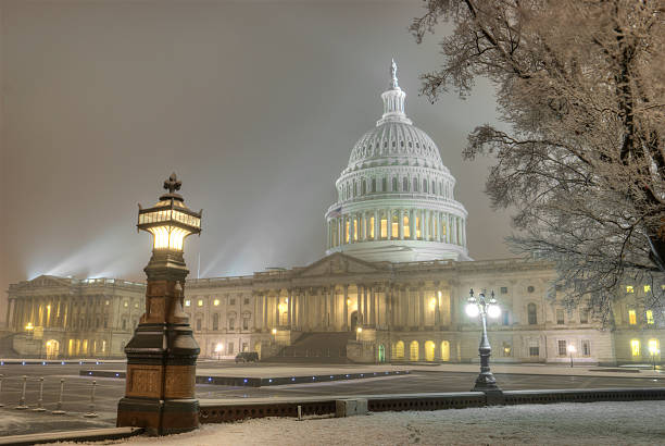 istock The Capitol building in Washington, DC covered in snow 464837505