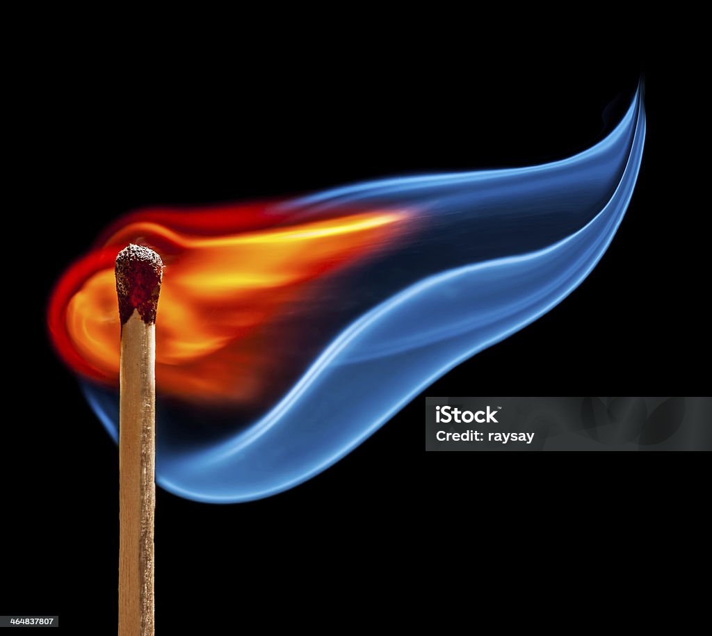 match is burning on black background wooden match is burning on black background Flame Stock Photo