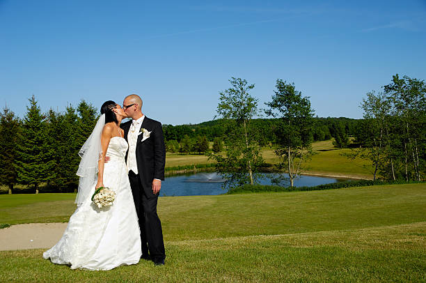istock Wedding couple kissing 464838585