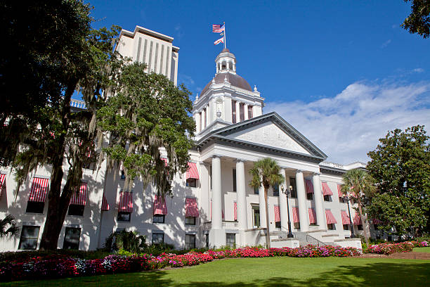 View of the Florida Stare Capitol in Tallahassee The old Florida State Capitol building as seen from Monroe St and Apalachee Parkway with the New Capitol in the background tallahassee stock pictures, royalty-free photos & images