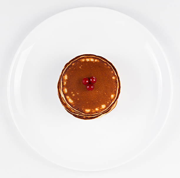 istock Pancakes with cranberries on a plate. 464841084