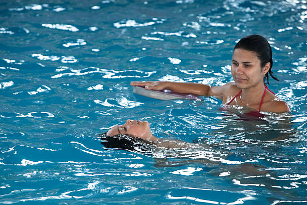 istock Mother playing with son in the pool. 464842112