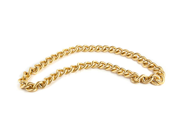 istock Golden chain of twisted rings. Isolated on white 464842578