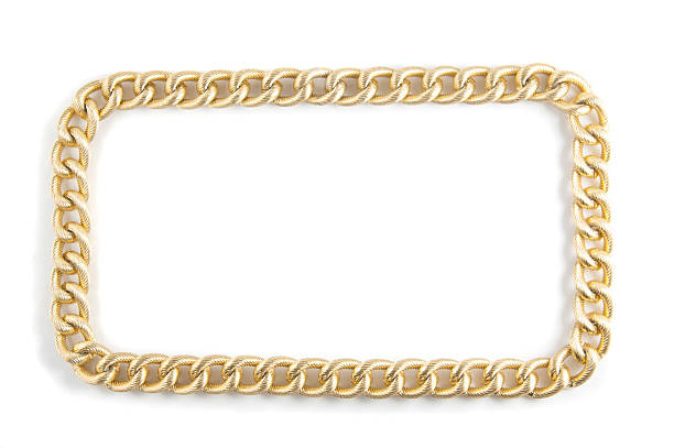 istock Golden chain of twisted rings. Isolated on white 464842584