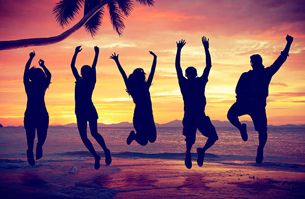 istock Young People Jumping with Excitement on the Beach 464843476