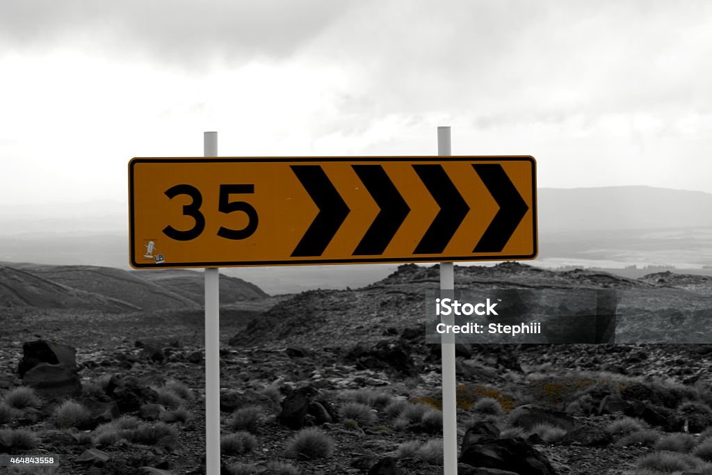 Curve road sign '35 km/h' in Tongariro Natianalpark in New Zealand 2015 Stock Photo