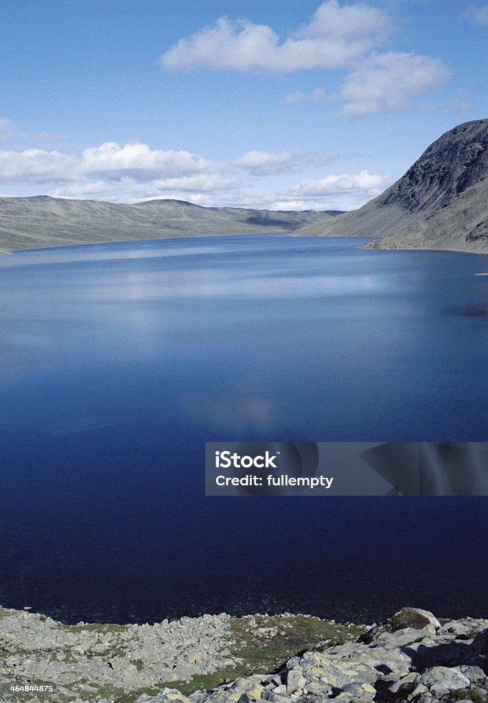 Blue lake and sky in Norway Vertical landscape of blue lake in Jotunheinmen, Norway, Europe Blue Stock Photo