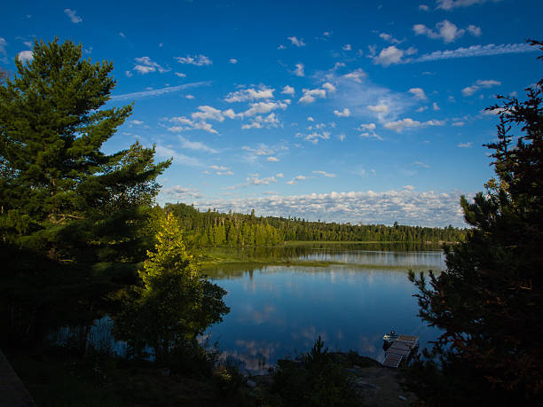Peaceful dawn over a  northern lake Tranquil fishing spot on a northern lake near Timmin, Ontario, CanadaPeaceful dawn over a  northern lake near Timmins, Ontario, Canada northern ontario stock pictures, royalty-free photos & images